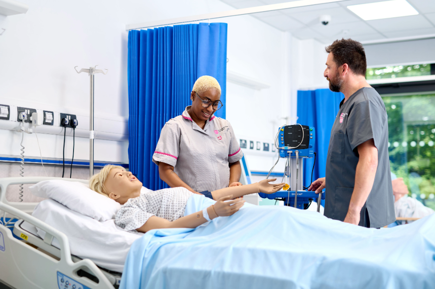 A student nurse working with a dummy in the HAP Centre