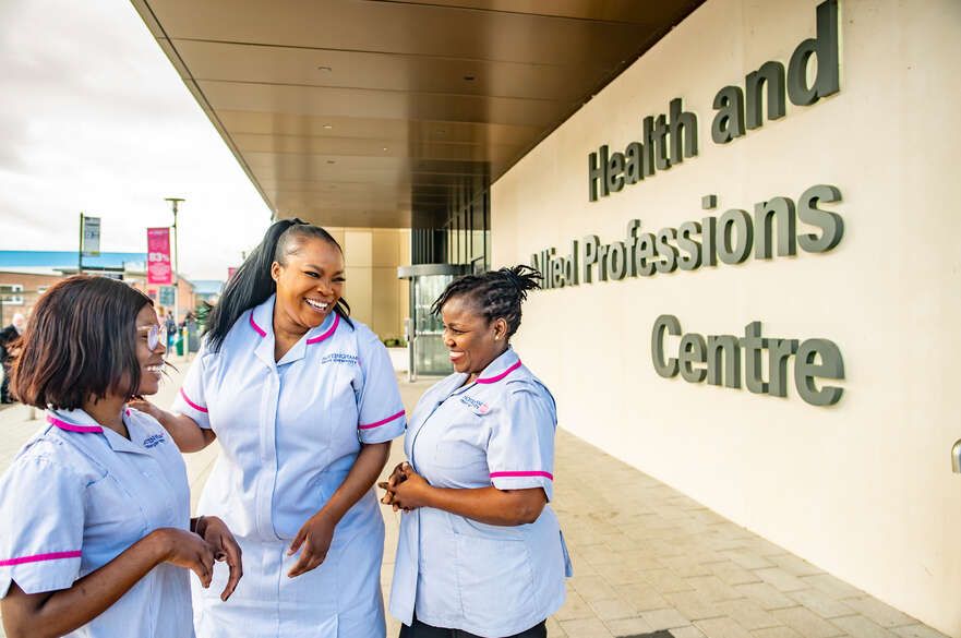 Three nursing students outside the HAP Centre on Clifton Campus