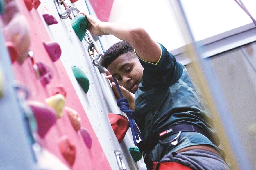 male on climbing wall