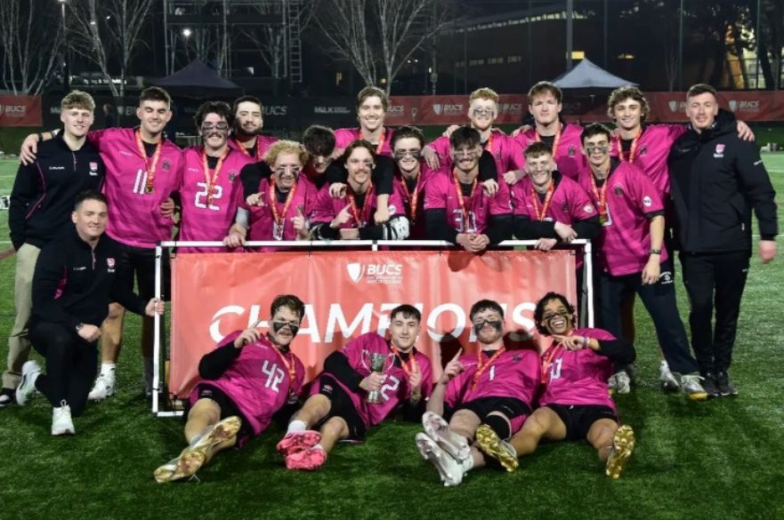 a photo of the lacrosse team celebrating
