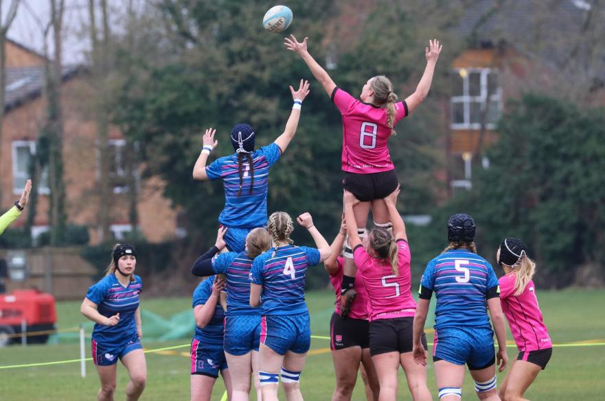 NTU Women's rugby team taking a throw in