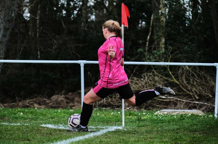 NTU Women's footballer taking a corner