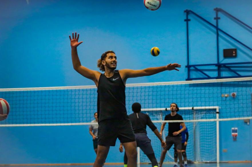 Man playing badminton in the NTU Sport Sports Hall