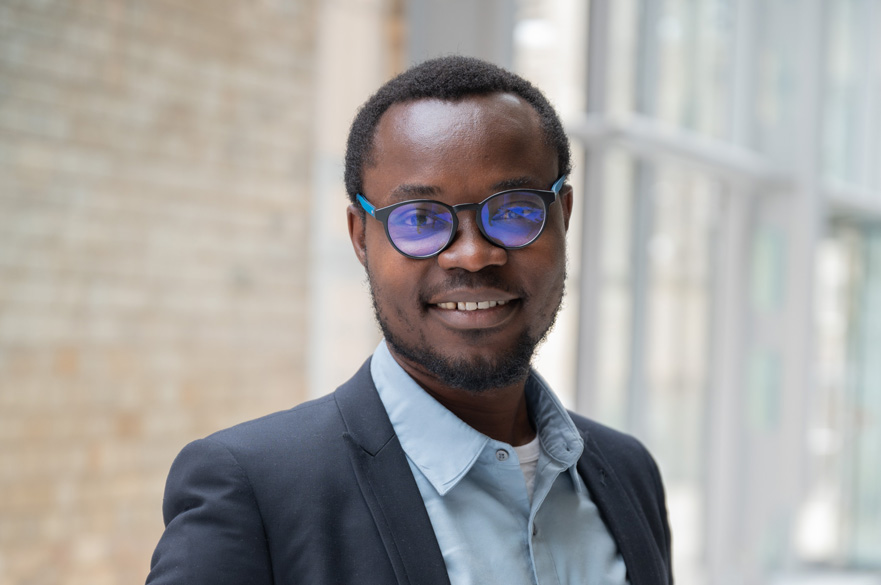 Victor Udeozor looking confident in a dark suit and light shirt
