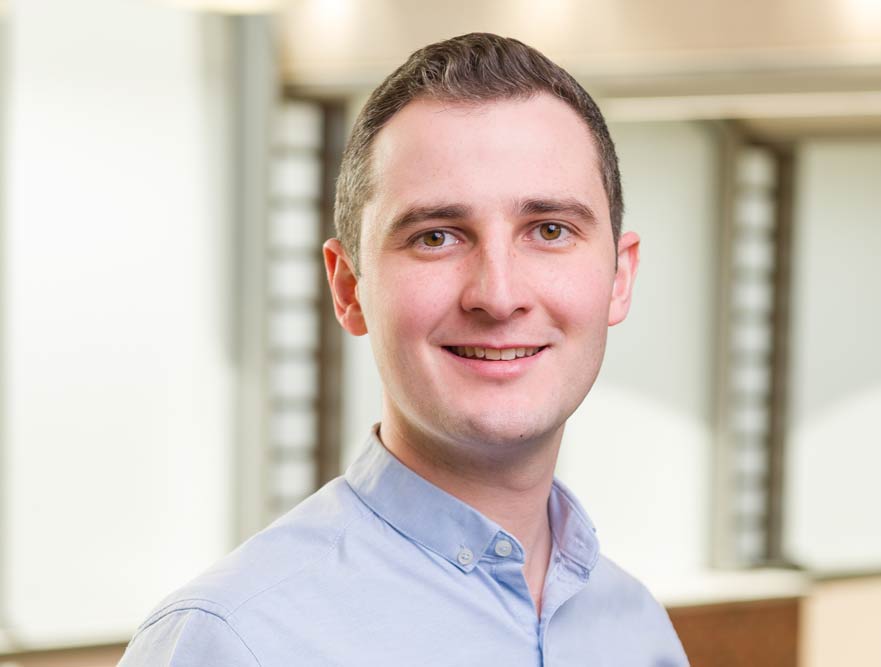 James posing for his staff profile photo