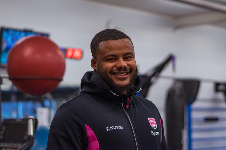 A picture of NTU Sport Fitness instructor, Cass, smiling in the gym