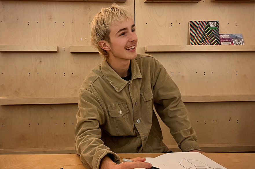 Harry working on his project and smiling