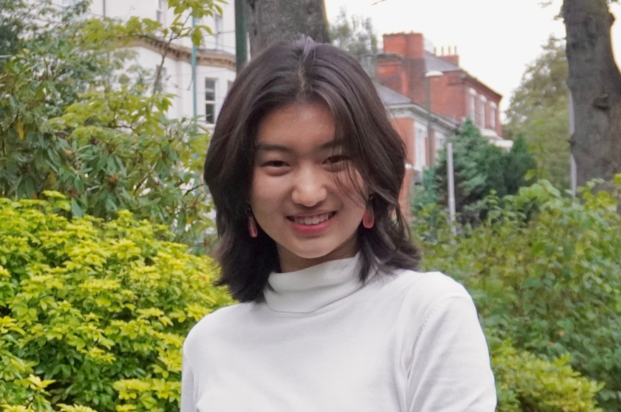 student looking at camera smiling