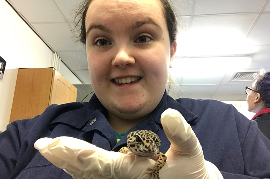 Student holding exotic animal