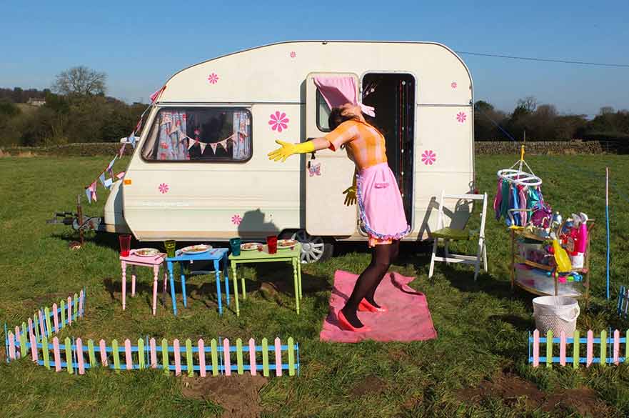 Woman standing outside caravan