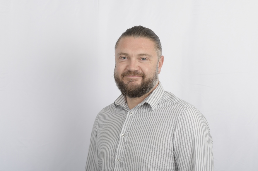 Man in shirt smiling