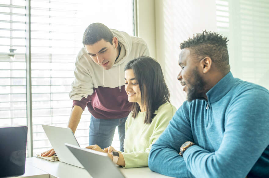 Students working together on laptop