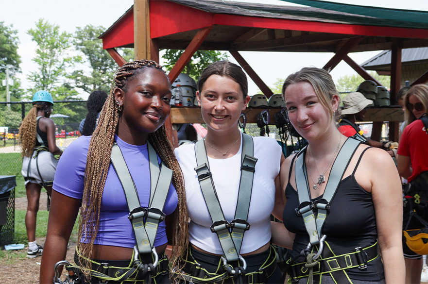 Students wearing harnesses at an activity during Humber College Summer School