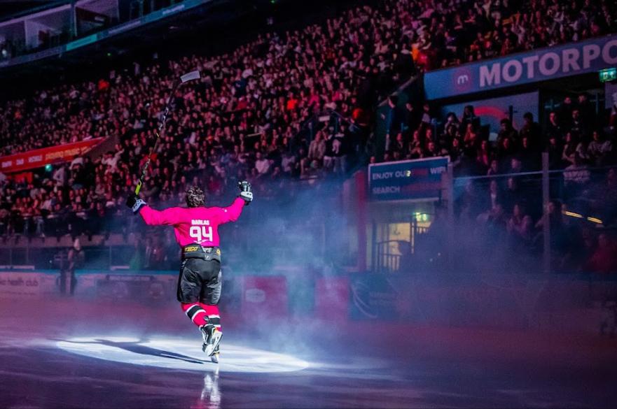 Image of an NTU Ice Hockey Player entering the rink in front of a sell out crowd at the Motorpoint arena in Nottingham 