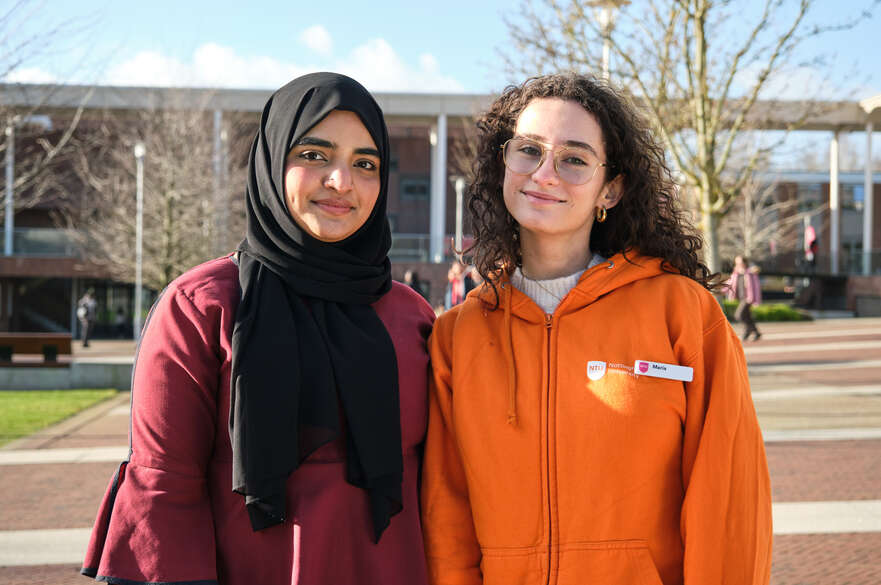 Two Global Lounge Ambassadors stand together at Clifton Campus