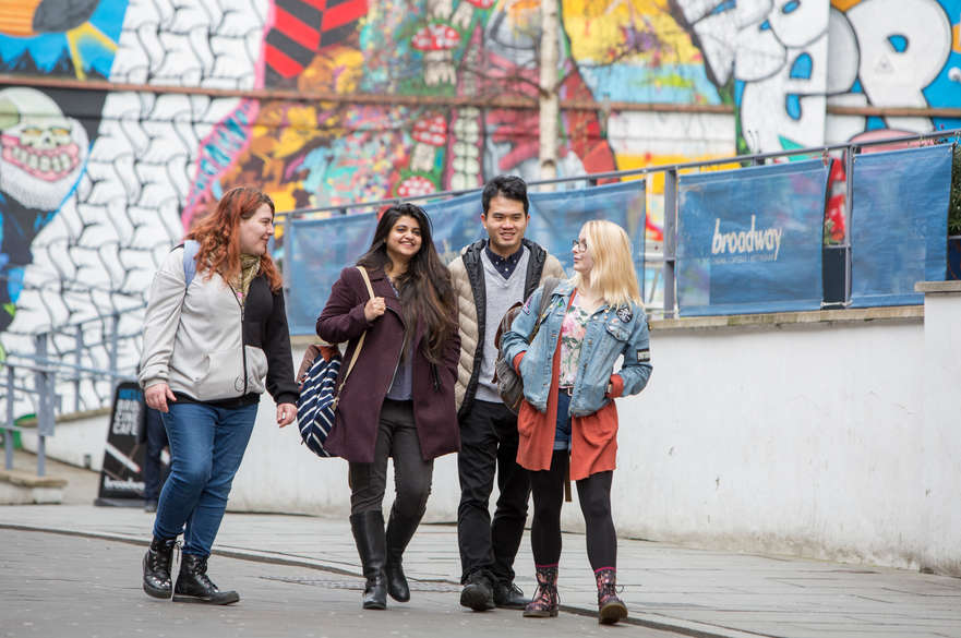 3 female 1 male student outside Broadway cinema in nottingham