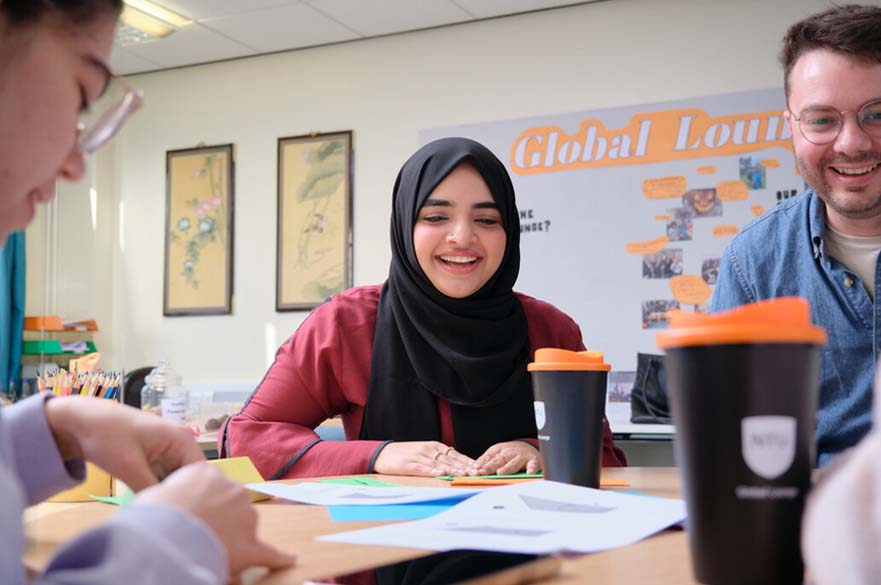 Student socialising in the Global Lounge