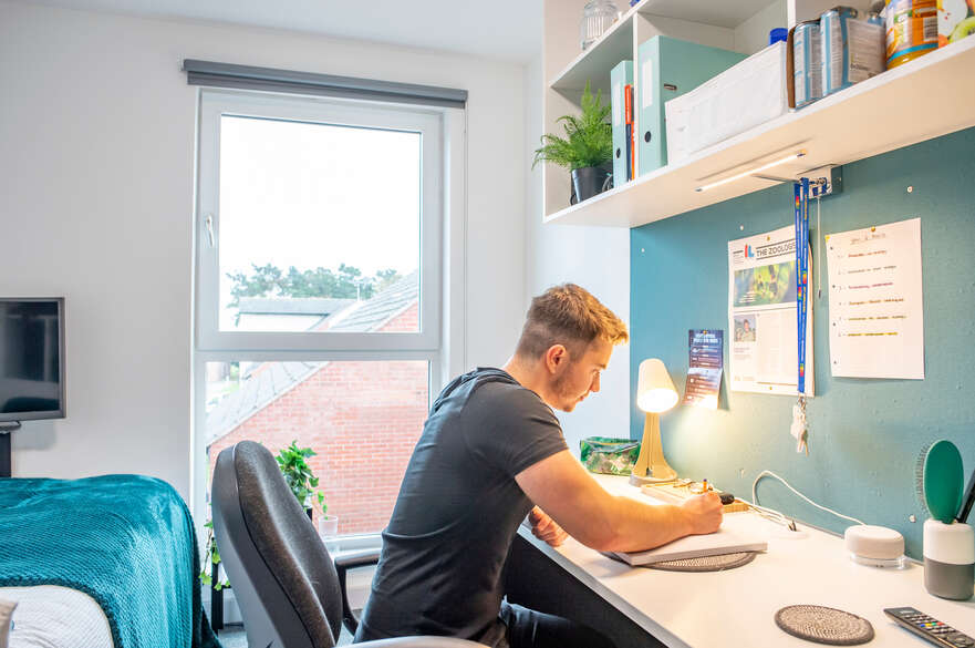 Student studying in his room